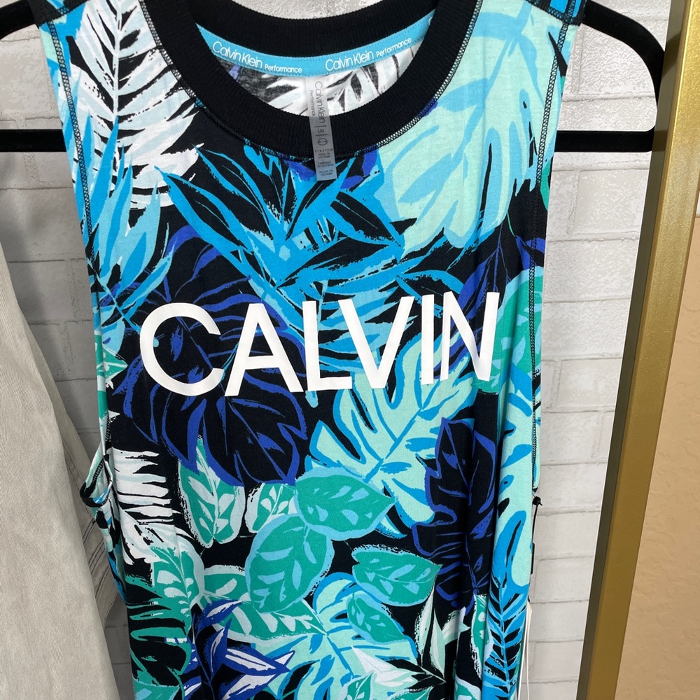 Sleeveless Calvin Klein Performance Shirt. I consider this unisex.